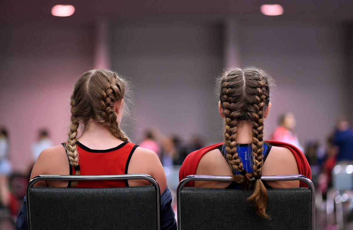 Competitors wait patiently before making their lifts in the under 13 year-old category at the USA Weightlifting National Youth Championship. (Wally Skalij / Los Angeles Times)