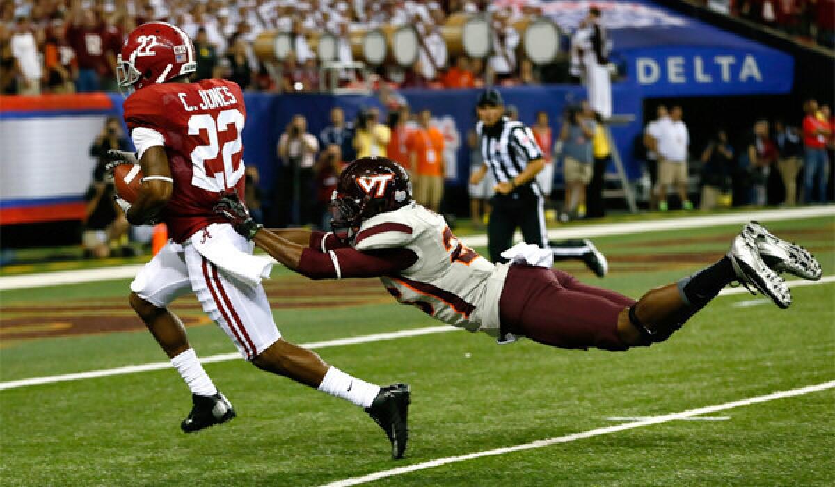 Alabama's Christion Jones beats Virginia Tech's Desmond Frye to score one of his three touchdowns during the Crimson Tide's season-opening 35-10 victory at the Georgia Dome on Saturday.