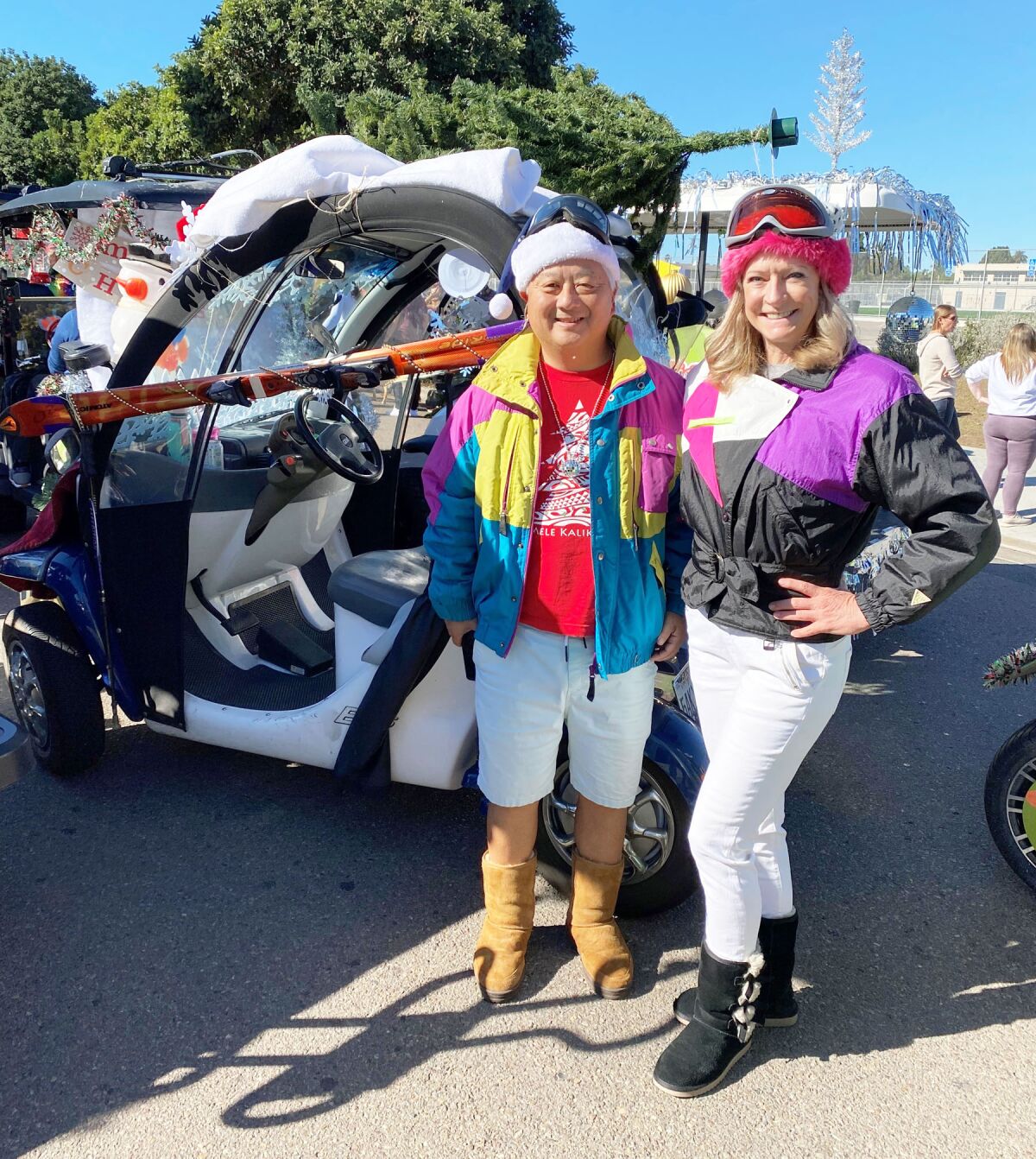 David Teraji and Jena Neuman show off their decorated golf cart for the 2021 PB Holiday Parade.