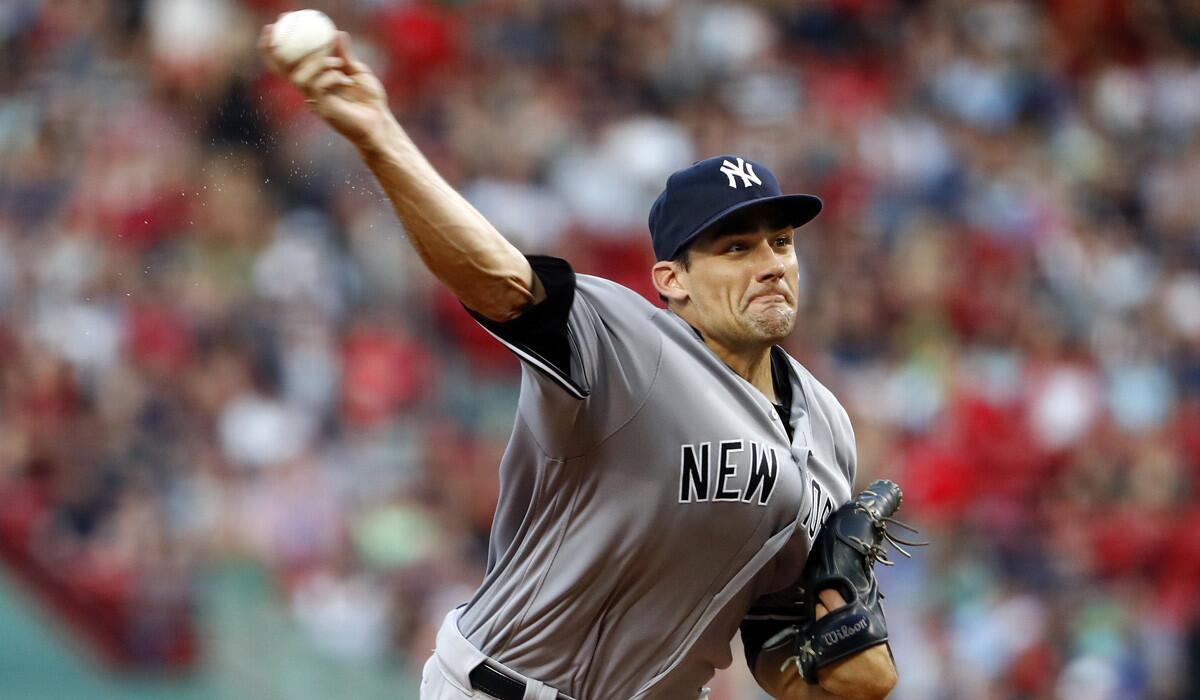 New York Yankees pitcher Nathan Eovaldi delivers a pitch against the Boston Red Sox during the first inning on Aug. 10.