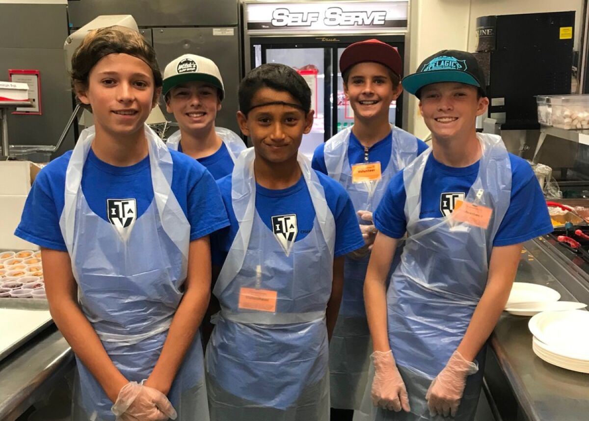 Teen Volunteers In Action spend some time serving food at Father Joe’s Villages.