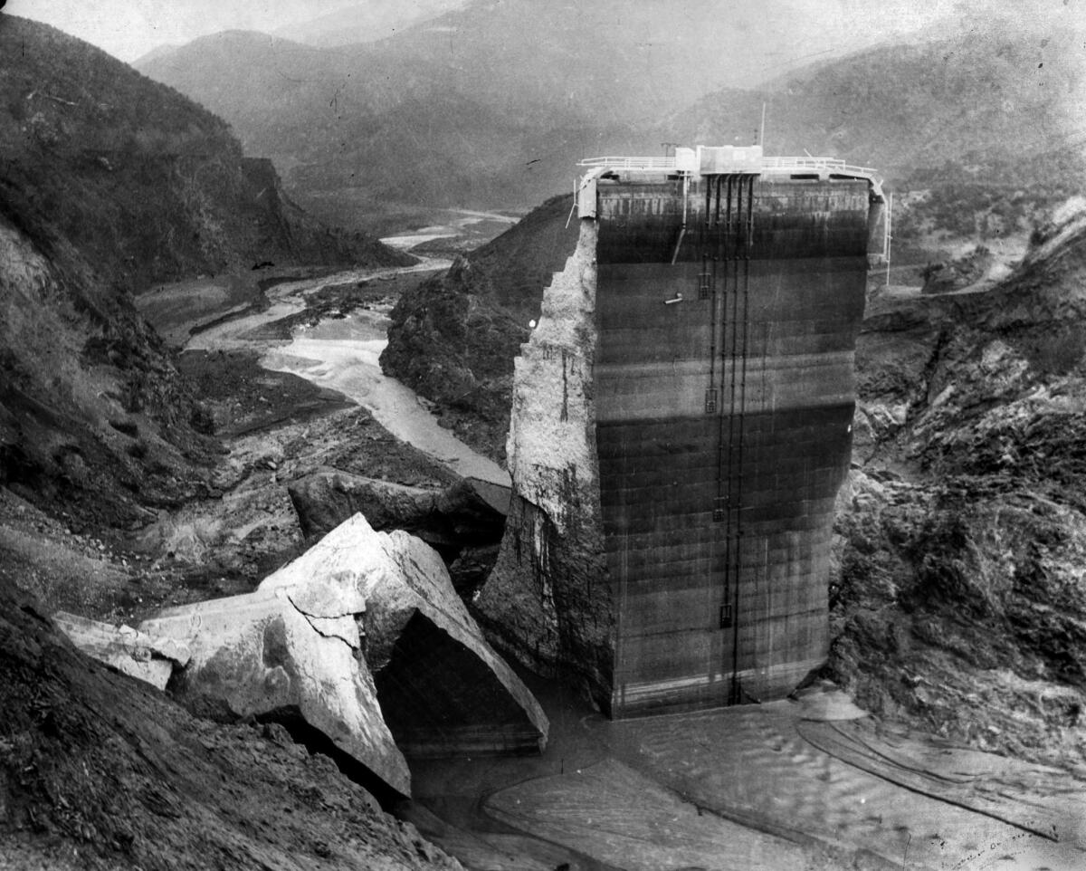 March 1928: Remaining section of St. Francis Dam with crumbled sections at base.