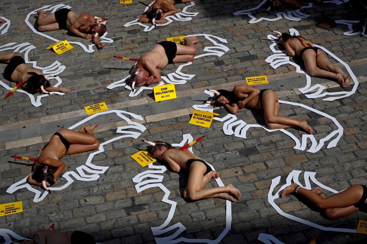 Animal rights activists stage a protest against bullfighting in Pamplona. (Villar Lopez / EPA/Shutterstock)