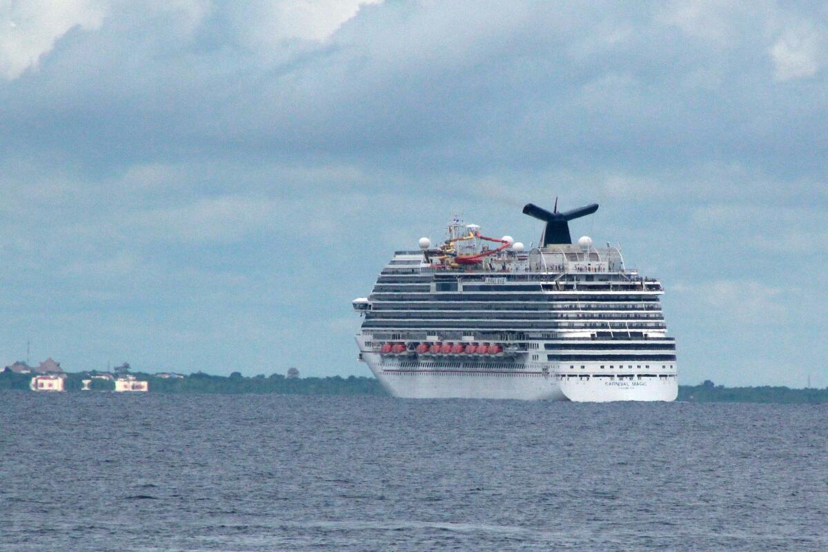 The cruise ship Carnival Magic passes near Cozumel, Mexico, on Friday.