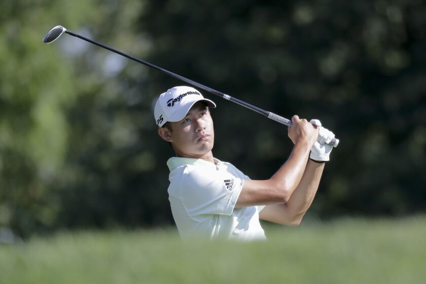 Collin Morikawa watches the ball after hitting from the third tee during a practice round for the Memorial golf tournament, Wednesday, July 15, 2020, in Dublin, Ohio. (AP Photo/Darron Cummings)