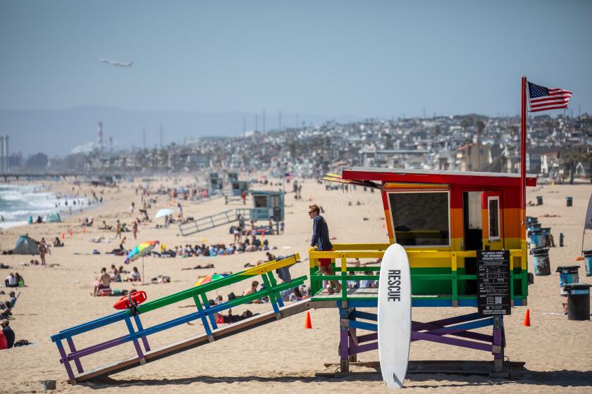 Hermosa Beach, CA - June 21: People flocked to the sand in Hermosa Beach, CA, on the first day of summer, Wednesday, June 21, 2023. (Jay L. Clendenin / Los Angeles Times)