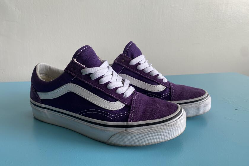 A pair of purple Vans Old Skool sneakers