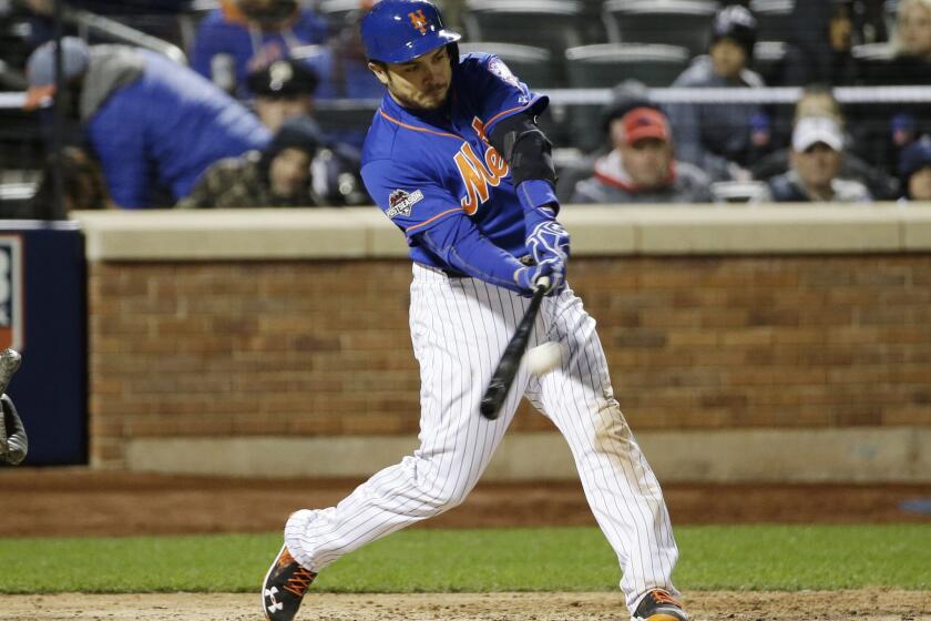 New York Mets catcher Travis d'Arnaud hits a home run during the sixth inning of Game 1 of the National League Championship Series against the Chicago Cubs on Oct. 17.