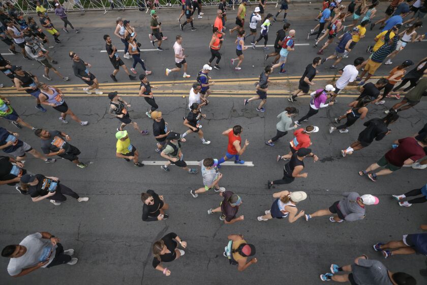 Runners head north on Sixth Avenue during the Rock 'n' Roll San Diego Marathon on Sixth Avenue in San Diego on Sunday, June 4, 2023.