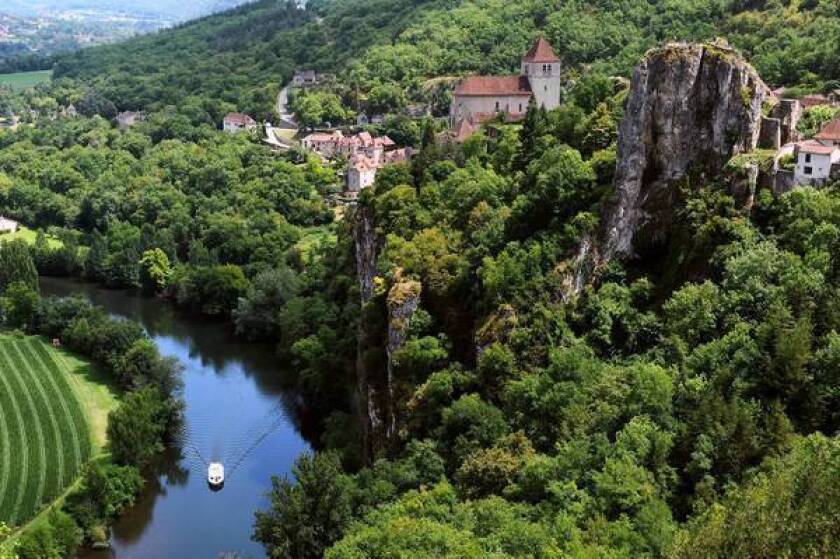 The village of Saint-Cirq Lapopie sits on a bluff above the Lot River in southwestern France.