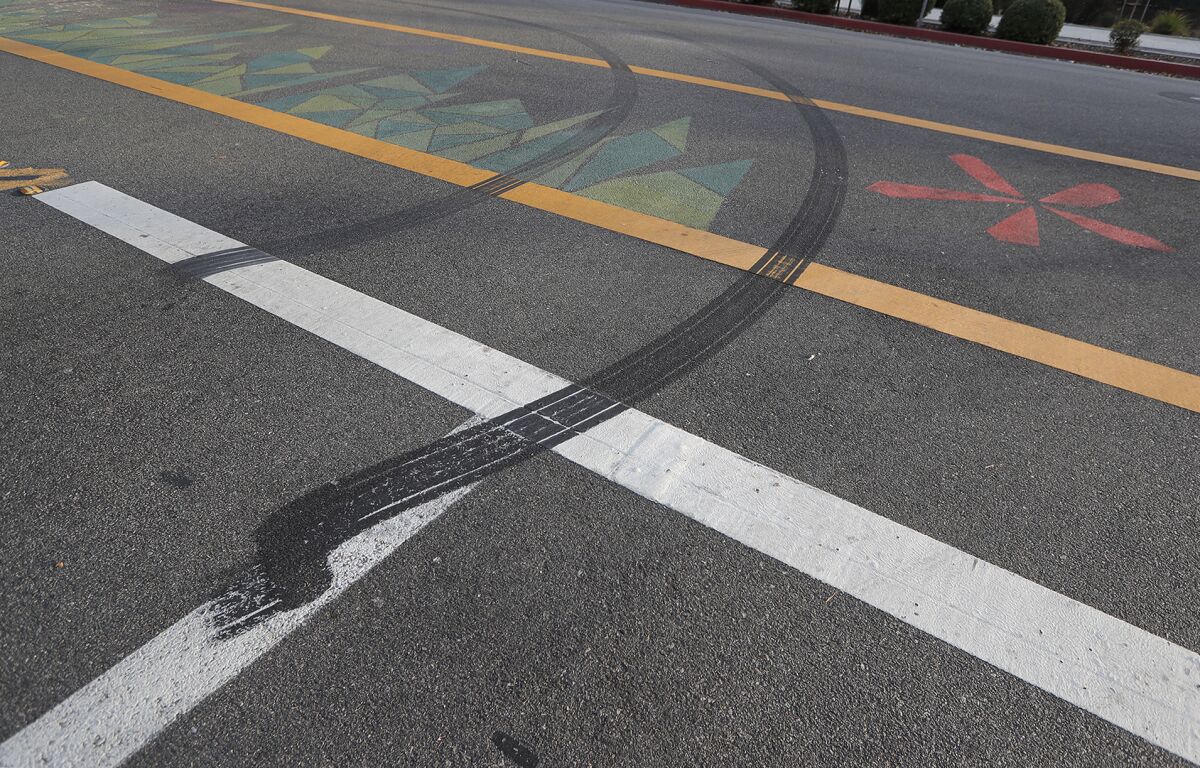 Tire marks can be seen where a fatal collision occurred Sunday in Costa Mesa.