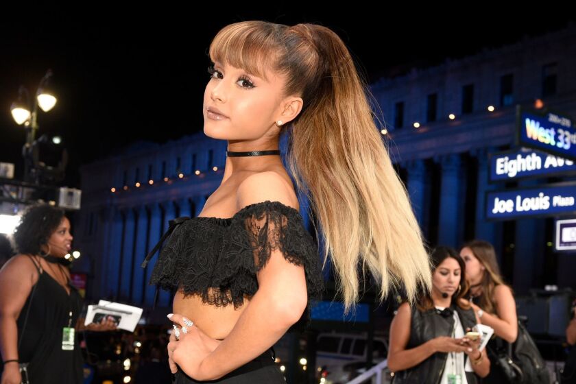 FILE - In this Aug. 28, 2016, file photo, Ariana Grande arrives at the MTV Video Music Awards at Madison Square Garden in New York. Grande's mother used a Twitter post on May 29, 2017, to reflect on the bombing of her daughter's May 22, 2017, concert in Manchester, England. (Photo by Chris Pizzello/Invision/AP, File)