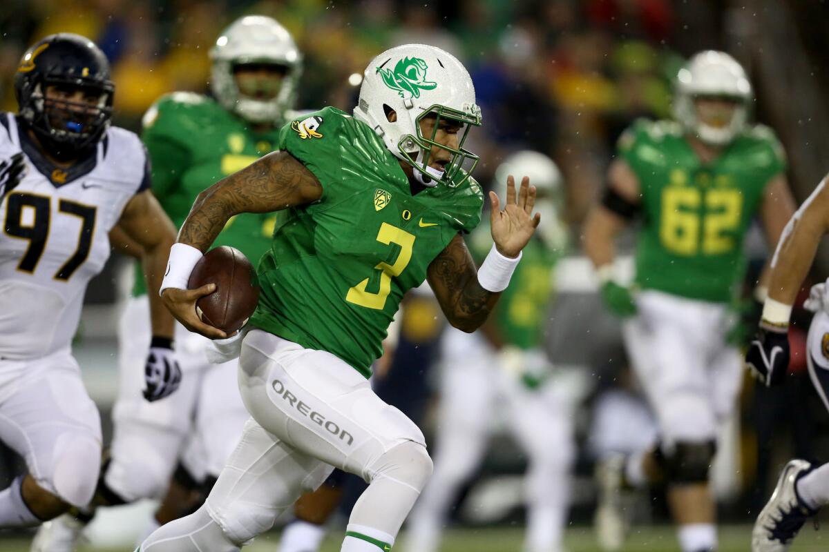 Oregon quarterback Vernon Adams Jr. (3) runs with the football during the first half of a game against California.