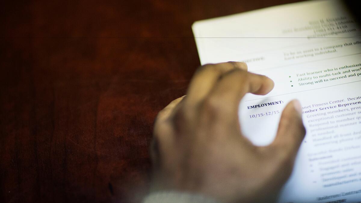A job candidate's resume sits on a table during a recruiting event at the Georgia Department of Labor office in Atlanta.