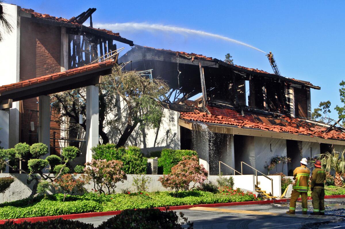 Firefighters battle the April 16, 2011, fire that gutted St. John Vianney Catholic Church in Hacienda Heights.