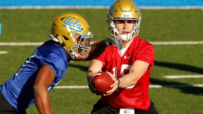 Matt Lynch, right, shown practicing with the Bruins in March 2018, has switched from quarterback to tight end.