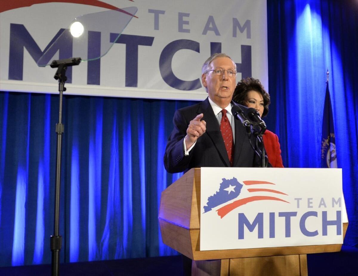 Senate Minority Leader Mitch McConnell (R-Ky.) -- accompanied by is his wife, former Secretary of Labor Elaine Chao -- addresses supporters at his victory celebration in Louisville, Ky., on Tuesday.