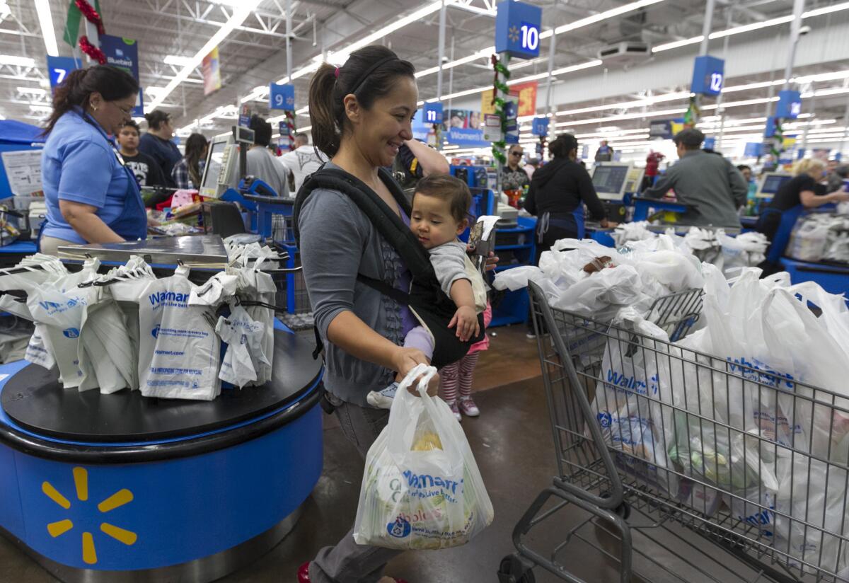 Wal-Mart said its profit rose in the fourth quarter but warned of flat sales for the current quarter.