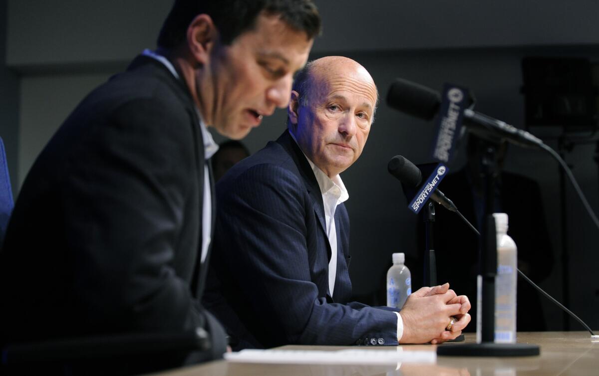 Andrew Friedman, left, and Stan Kasten answer questions during a news conference in 2014.