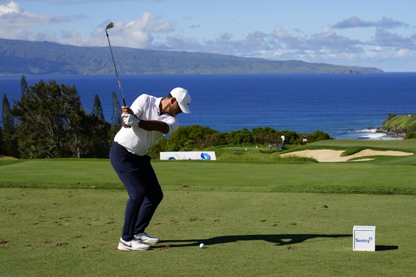 Brooks Koepka plays his shot from the 11th tee during the second round of the Tournament of Champions golf event, Friday, Jan. 7, 2022, at Kapalua Plantation Course in Kapalua, Hawaii. (AP Photo/Matt York)
