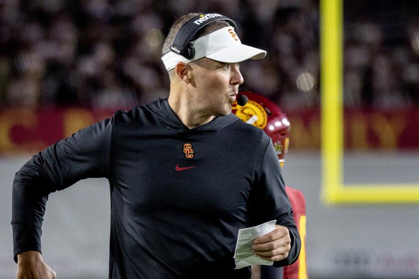 LOS ANGELES, CA - OCTOBER 7, 2023: USC Trojans head coach Lincoln Riley calls an offensive play.