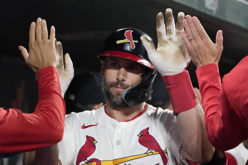St. Louis Cardinals' Paul Goldschmidt is congratulated by teammates after hitting a two-run home run during the fifth inning of a baseball game against the Chicago Cubs Sunday, May 26, 2024, in St. Louis. (AP Photo/Jeff Roberson)