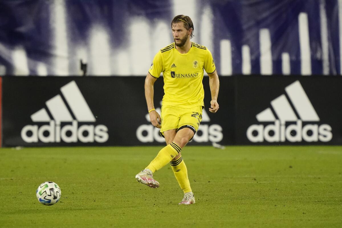 Nashville SC defender Walker Zimmerman plays against New England Revolution.