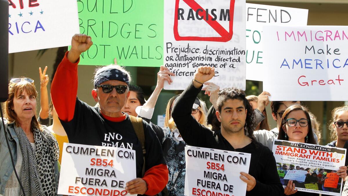 Immigration supporters rally before an Escondido City Council meeting on Wednesday.