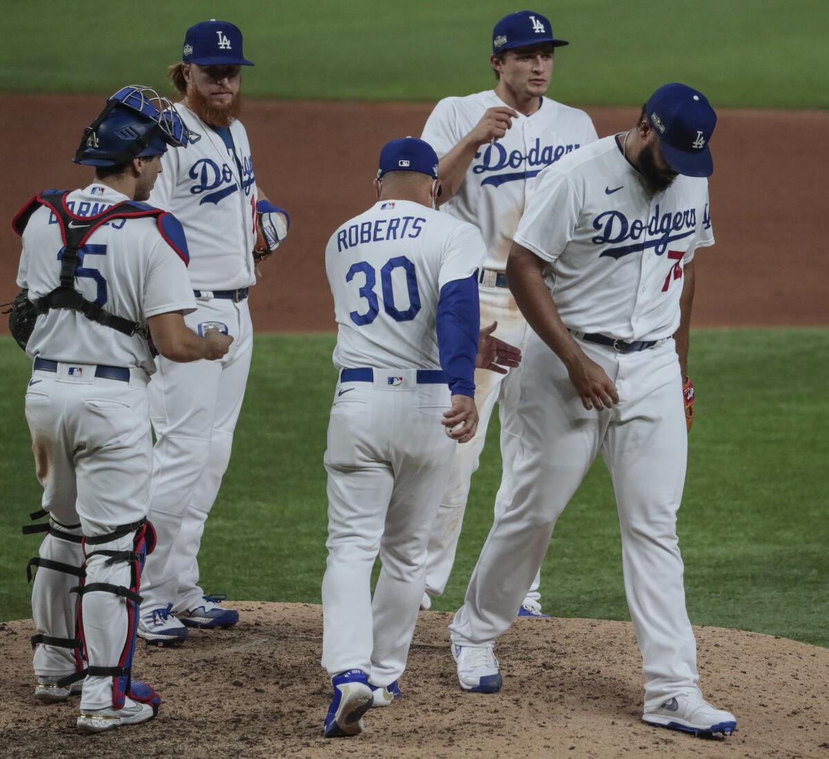 Los Angeles Dodgers relief pitcher Kenley Jansen (74) is pulled from the game 