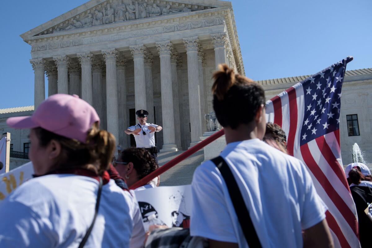 Activists gather during a March 18 immigration rally outside the Supreme Court.