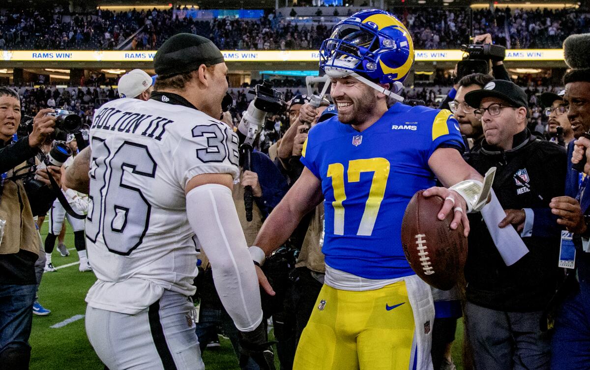 Rams quarterback Baker Mayfield is congratulated by Raiders linebacker Curtis Bolton.