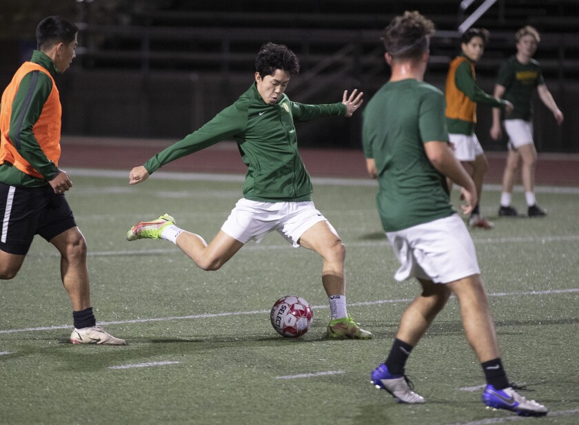 Moorpark High's Justin Conyers kicks the ball during practice.