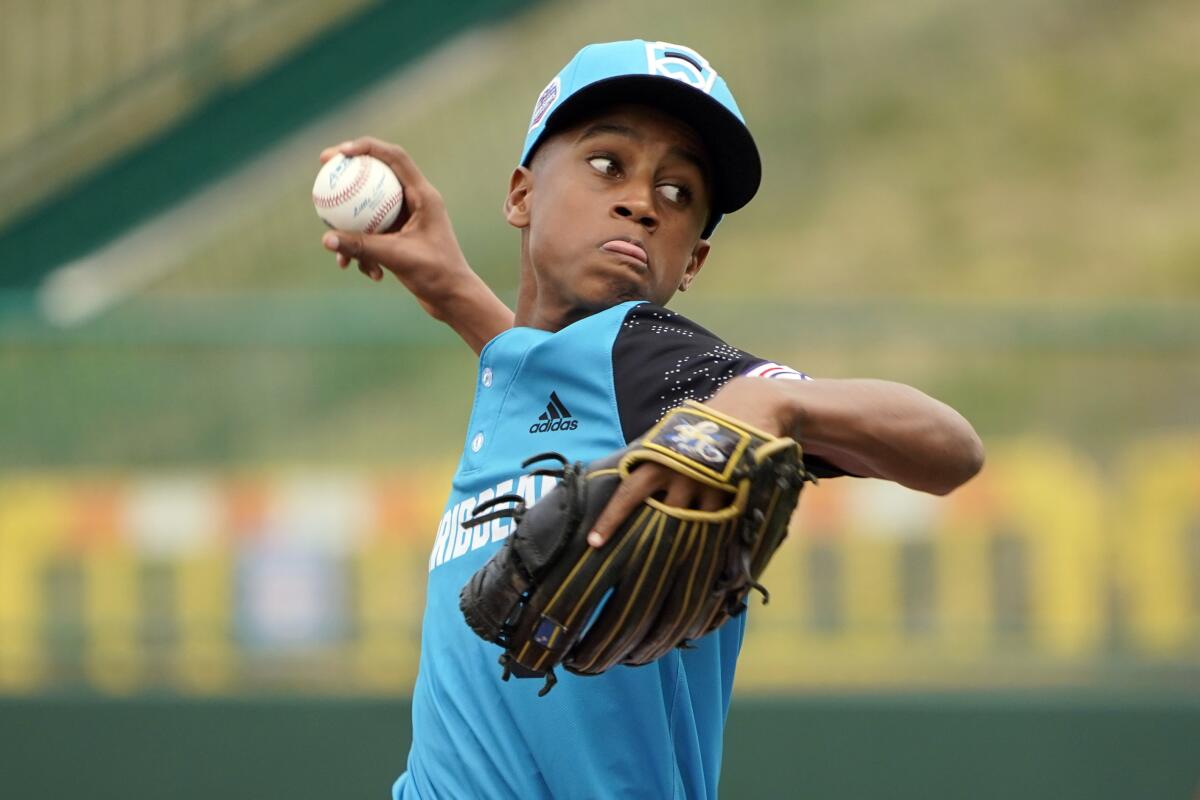 Curacao's Davey-Jay Rijke (8) delivers a pitch against Nicaragua during the fourth inning of a baseball game at the Little League World Series tournament in South Williamsport, Pa., Wednesday, Aug. 17, 2022. Curacao won the game 2-0. (AP Photo/Tom E. Puskar)