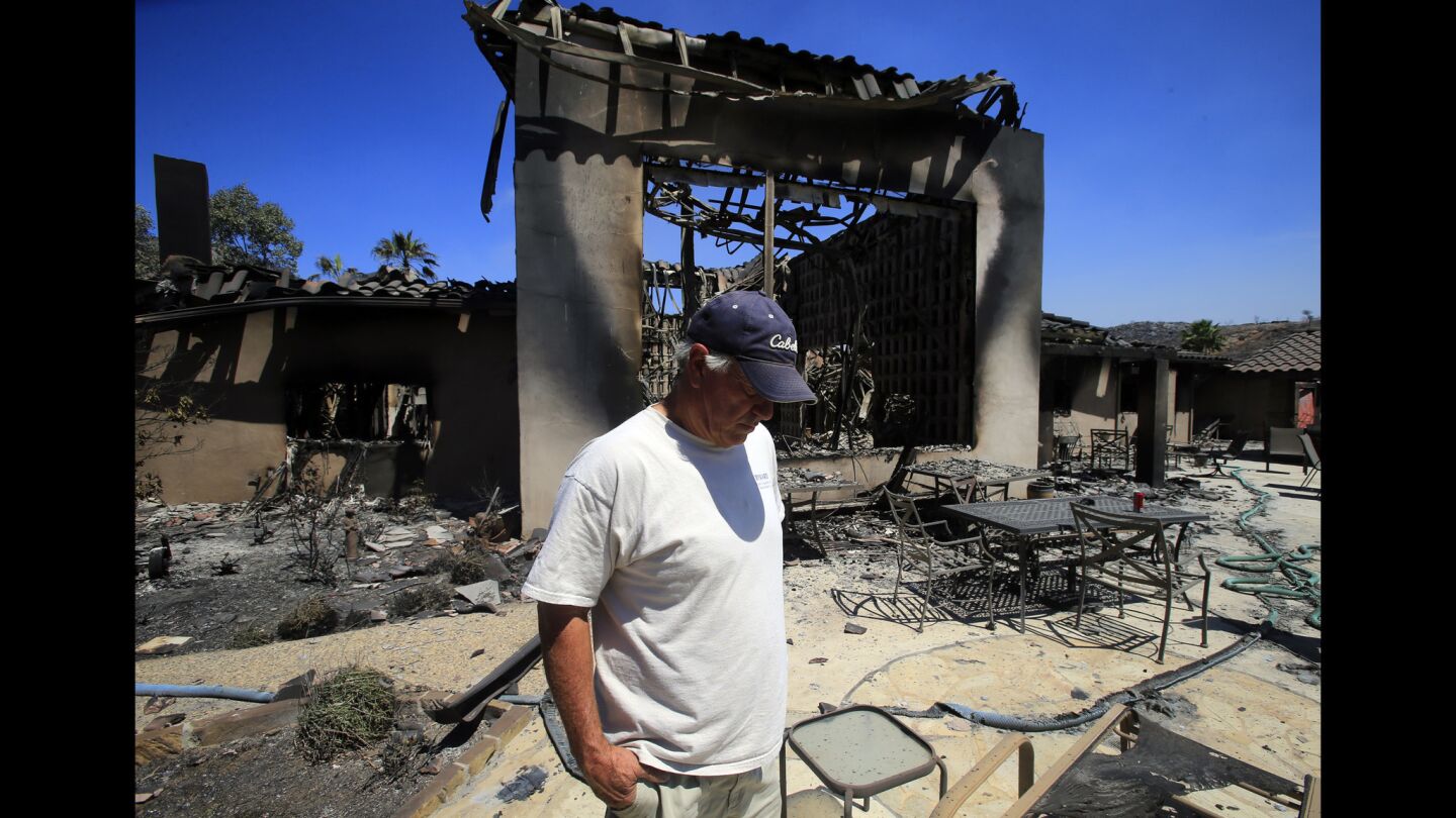David Roberts surveys the ruins of his Escondido home, destroyed by the Cocos fire. Built with concrete and steel, it still could not withstand the relentless flames.
