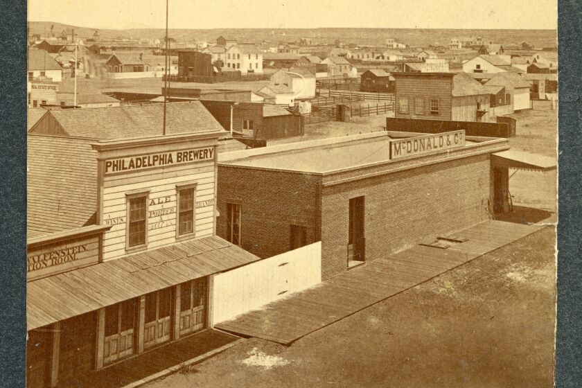 McDonald & Co. (lumber and merchandise), stood at the corner of Sixth and K streets. 