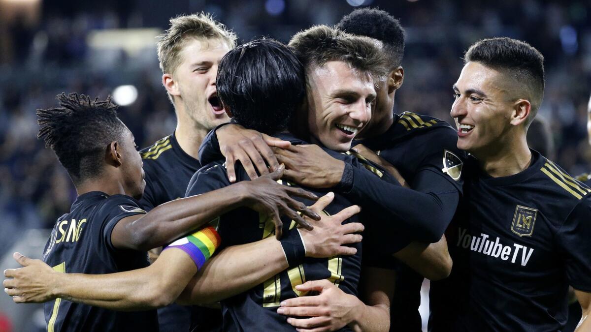 LAFC defender Tristan Blackmon, third from right, celebrates his goal with teammates during the second half against the Montreal Impact on Friday.