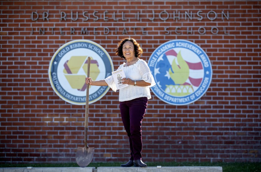 Janice Munemitsu, the author of "The Kindness of Color," poses for a photo in front of Johnson Middle School in Westminster.