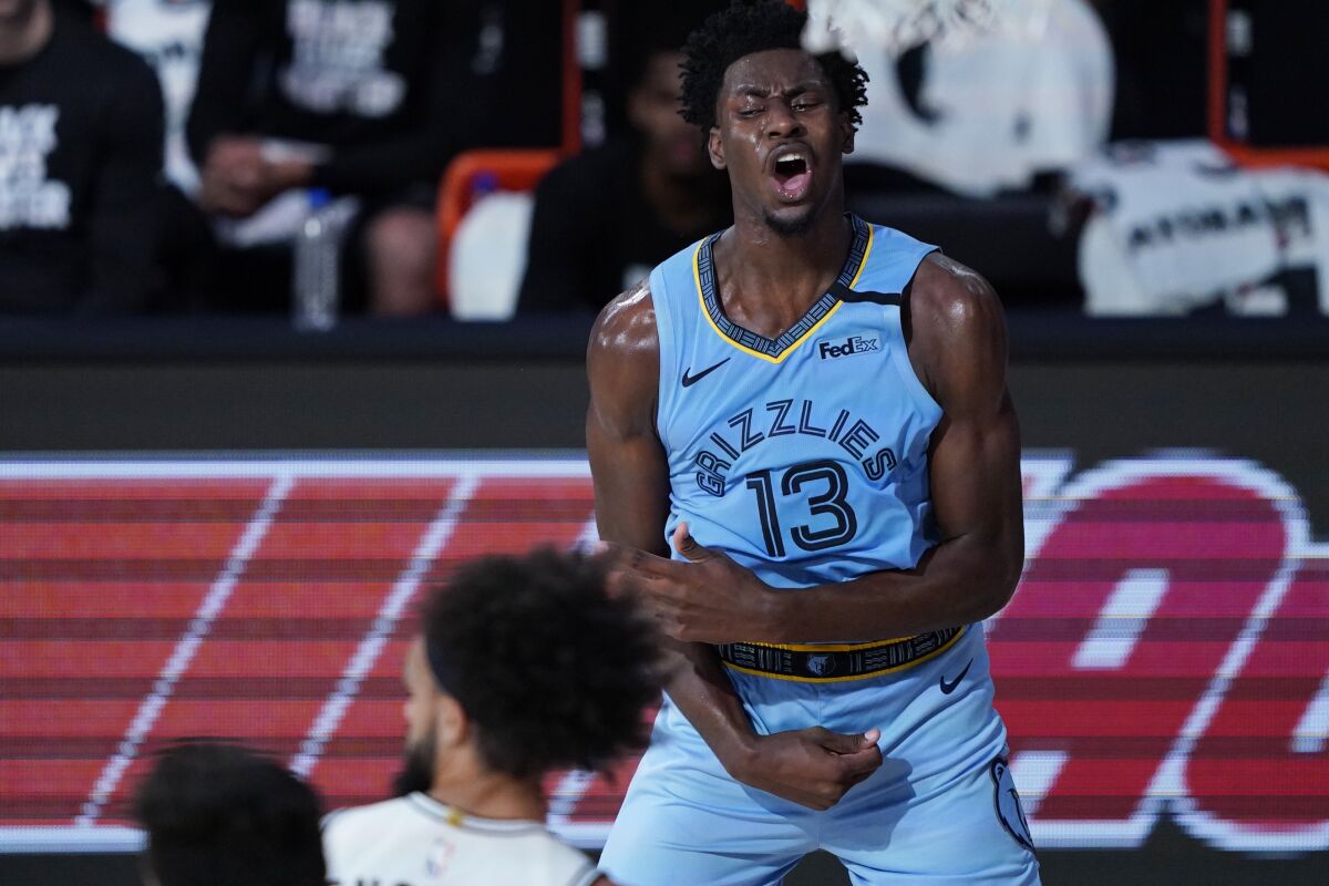 Memphis Grizzlies' Jaren Jackson Jr. (13) reacts after a play against the San Antonio Spurs during the second half of an NBA basketball game Sunday, Aug. 2, 2020, in Lake Buena Vista, Fla. (AP Photo/Ashley Landis, Pool)