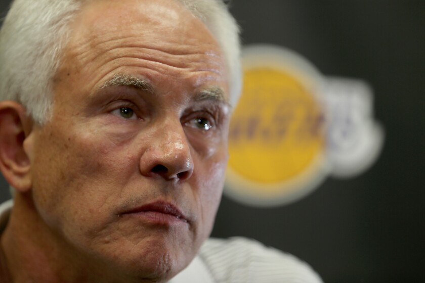 Lakers General Manager Mitch Kupchak answers reporters' question during a news conference at the team's training facility in El Segundo on Sept. 24, 2015.