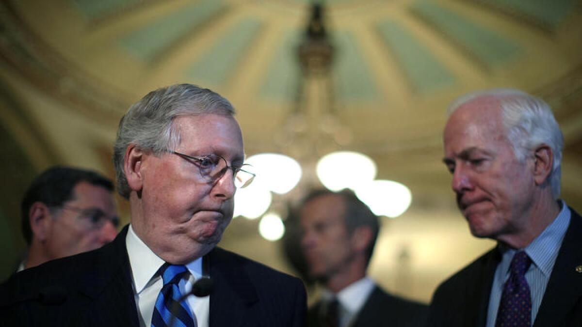 Senate Majority Leader Mitch McConnell (R-Ky.), left, and Senate Majority Whip John Cornyn (R-Texas) at the Capitol.