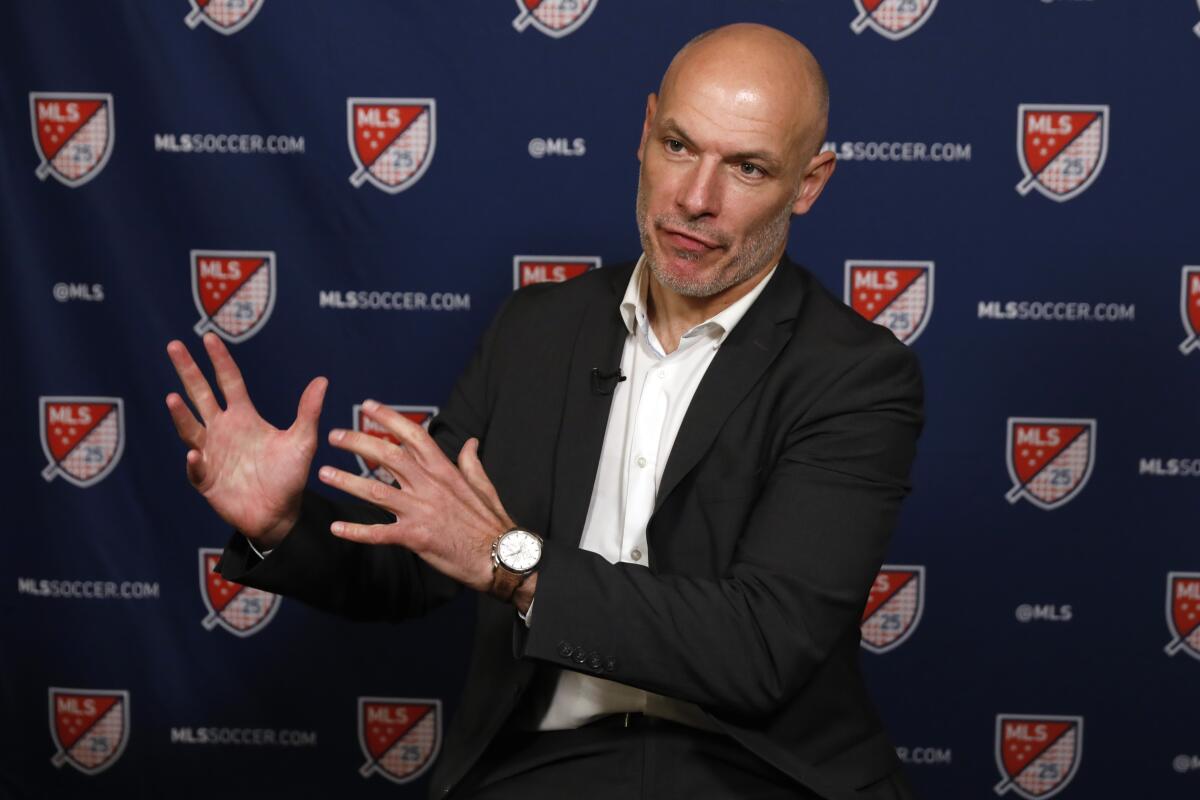 Referee Howard Webb gestures during an interview in 2020.