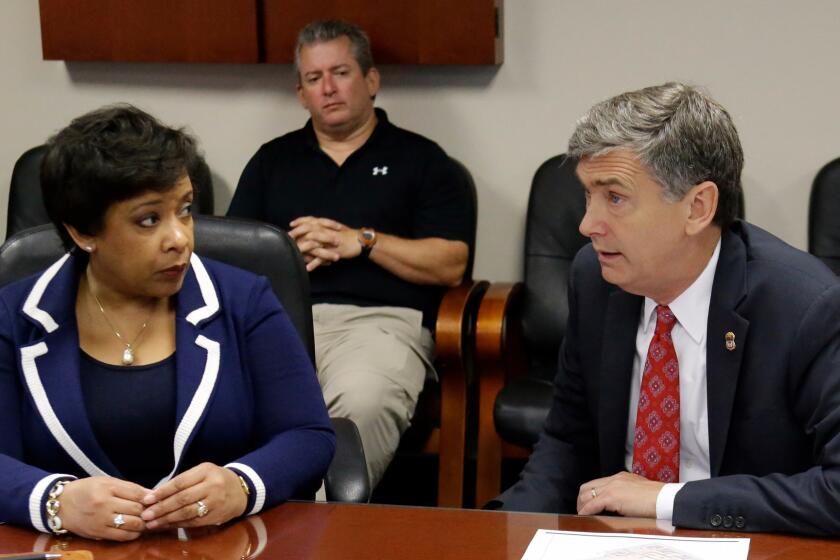 U.S. Atty. Gen. Loretta Lynch meets with U.S. Atty. Lee Bentley at the Orlando FBI office for a briefing on the Pulse nightclub mass shooting.