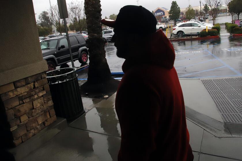 Cesar Hernandez, 37, walks to his car in a shopping center in Moreno Valley on Wednesday, March 29, 2023. 