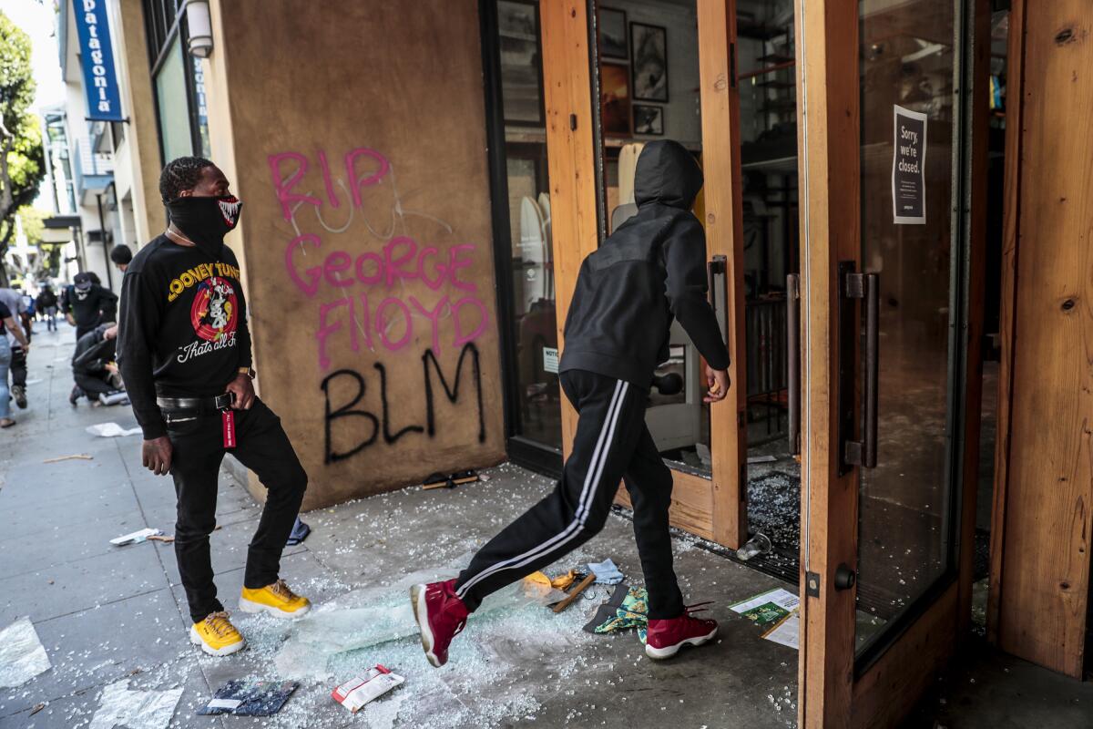 A Patagonia store in Santa Monica is vandalized Sunday amid a day of unrest in Santa Monica