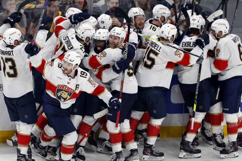 The Florida Panthers celebrate after defeating the Boston Bruins on a goal by Carter Verhaeghe.