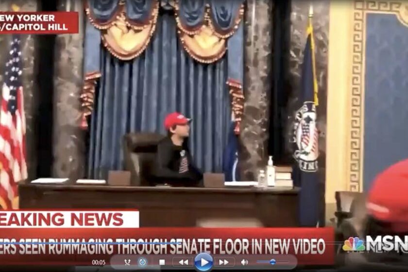 Christian Secor, was captured on video camera inside the Senate chambers sitting at the Presiding Officer's chair, after the pro-Trump mob broke into the Capitol.
