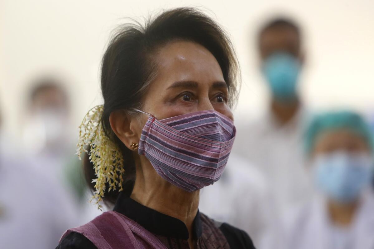 FILE - In this Jan 27, 2021, file photo, Myanmar leader Aung San Suu Kyi watches the vaccination of health workers at hospital in Naypyitaw, Myanmar. A court in Myanmar ruled Tuesday that the trial on charges of incitement of ousted national leader Aung San Suu Kyi and two of her political allies proceed to its substantive second phase, in which the defendants can present their case. Suu Kyi and her elected government were ousted by a military takeover in February. (AP Photo/Aung Shine Oo, File)