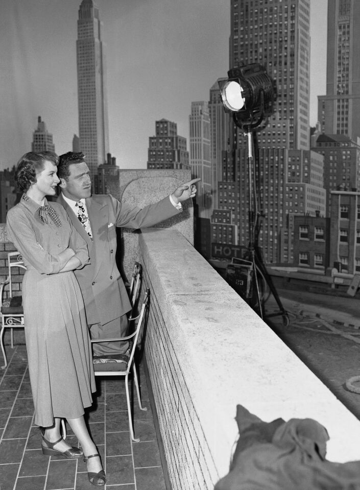James Whitmore points out buildings of the Manhattan skyline to British actress Deborah Kerr on a Hollywood sound stage, Sept. 18, 1949. The backdrop was prepared for a scene in "Please Believe Me."