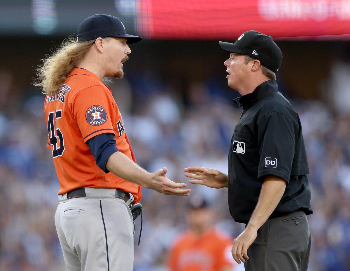 Houston Astros reliever Ryne Stanek argues a balk call from second base umpire Junior Valentine.