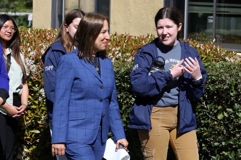 California Lt. Gov. Ellen Kounalakis, left, listens to UC Irvine Political Science student Kylie Halliday, right, talk about the history of Mesa student housing during a tour of the Mesa court expansion at the University of Irvine in Irvine on Monday, April 10, 2023. (Photo by James Carbone)